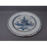 European Delft circular plate, centre typically painted in underglaze blue with flowering tree