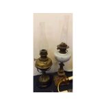 Victorian brass oil lamp with brass font on a circular black glass base, cast stand, together with a