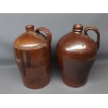 Two stoneware glazed flagons, with impressed decoration, 13ins tall