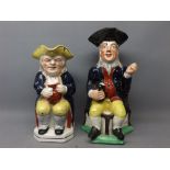 Two Staffordshire models of Toby Jugs, (both a/f), largest 11 1/2 ins tall