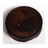 Early 19th century black lacquer papier m ch tobacco box of circular form with pull off cover and