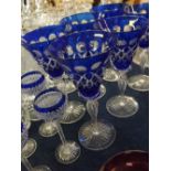 Set of 5 blue flash cut toddy glasses with cut bowls and faceted stems, 5ins tall, together with a