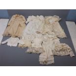 Box containing a quantity of child's vintage clothing including dresses and accessories (qty)