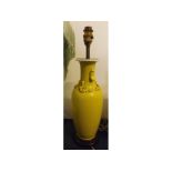 Oriental yellow ground vase converted to an oil lamp, raised decoration, on a turned socle, (lacking