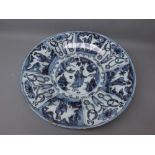 European Delft charger, painted in underglaze blue with central figure motif within radiating border