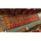 Large vintage Kelim rug, red, orange and black geometric patterns throughout, 114ins x 54ins