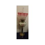 Victorian brass oil lamp, opaque font, painted floral decoration and an etched floral and