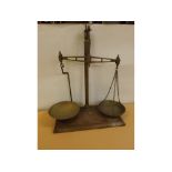 Pair of mahogany based brass pole balance scales with two brass pans, 19ins tall
