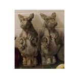 Large pair of composition models of gryphons each holding a shield, 25ins tall (2)