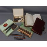 Mixed Lot: two red leather and brass mounted lockable cash books (one key only unlocks both books)