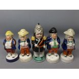 Five 19th century Staffordshire pepperettes modelled as figures, one as a French soldier with a