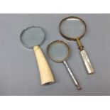 Group of three assorted magnifying glasses with bone, mother of pearl and metal handles, (3)