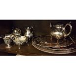 Group of silver plated wares including four-piece tea set, two revolving butter dishes with glass
