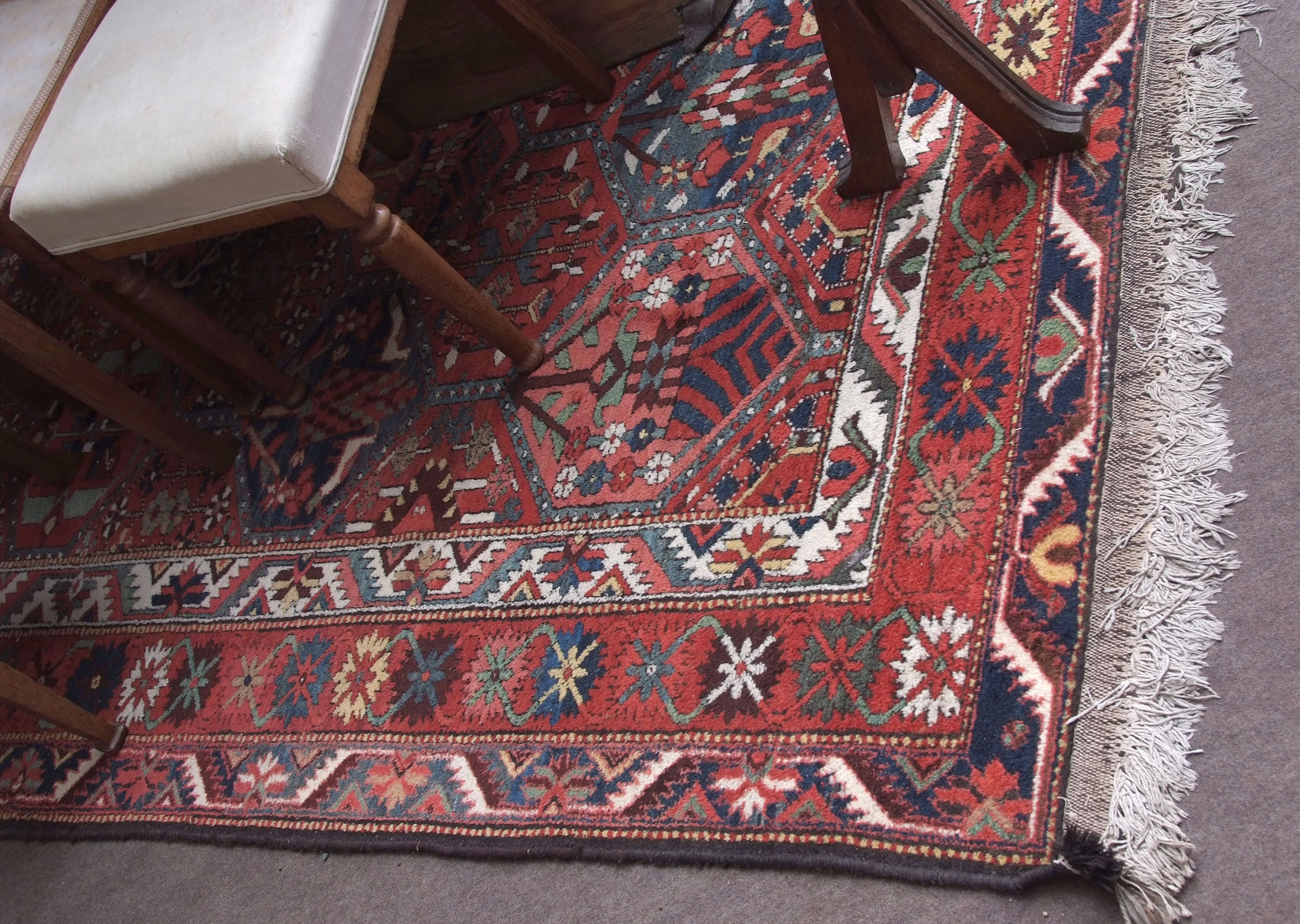 Caucasian wool rug, multi-bordered and with geometric patterns in red, blue and white, 120 1/2 ins x