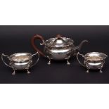 George V three piece tea set comprising tea pot, sugar basin and milk jug, each of compressed