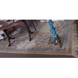 Chinese washed wool carpet with green and dusky pink floral decoration to a beige ground, 109 ins