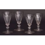 Collection of 19 various 19th and 20th century facetted conical wine glasses, many with knopped