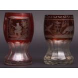 Two Bohemian glass red tinted footed beakers, the bodies of each engraved with sporting scenes, both