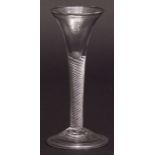 18th century wine glass with latticinio air twist stem on a spreading circular folded foot, 6ins