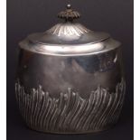 Late Victorian tea canister of oval form, hinged and domed cover, to a polished body with wrythen