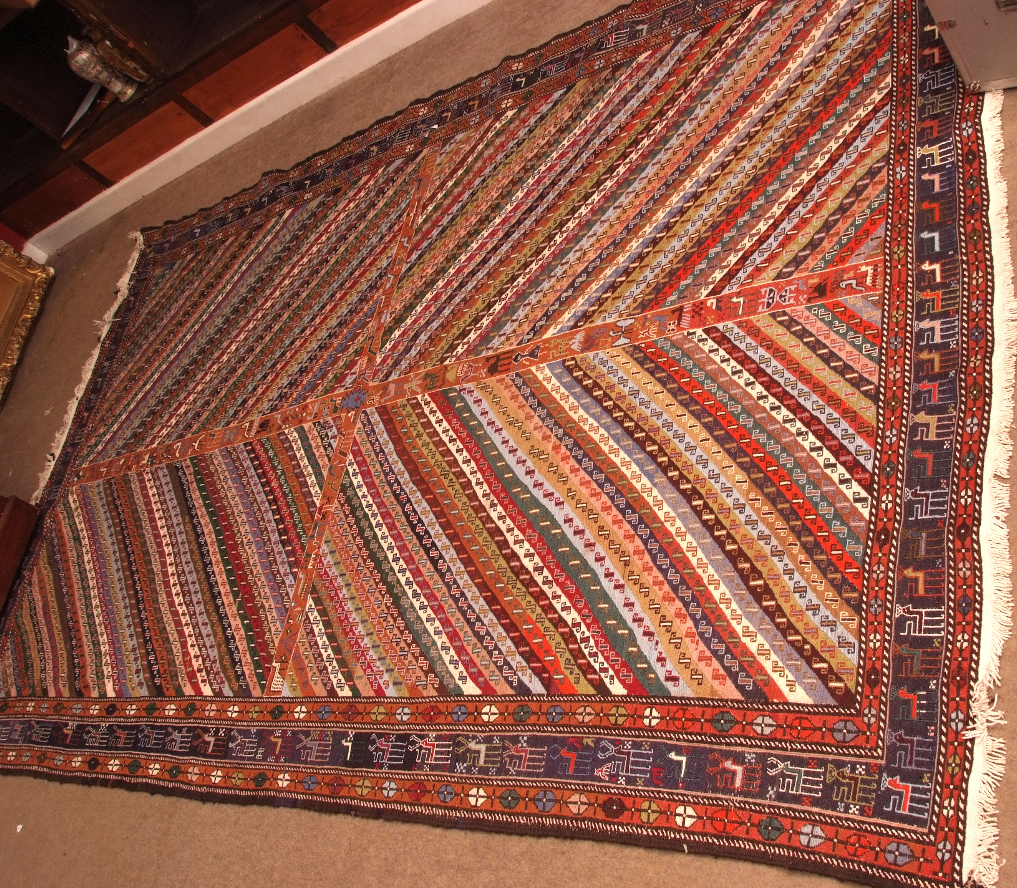 Caucasian woolwork carpet/wall hanging, triple gull border, central panel of diagonal geometrical