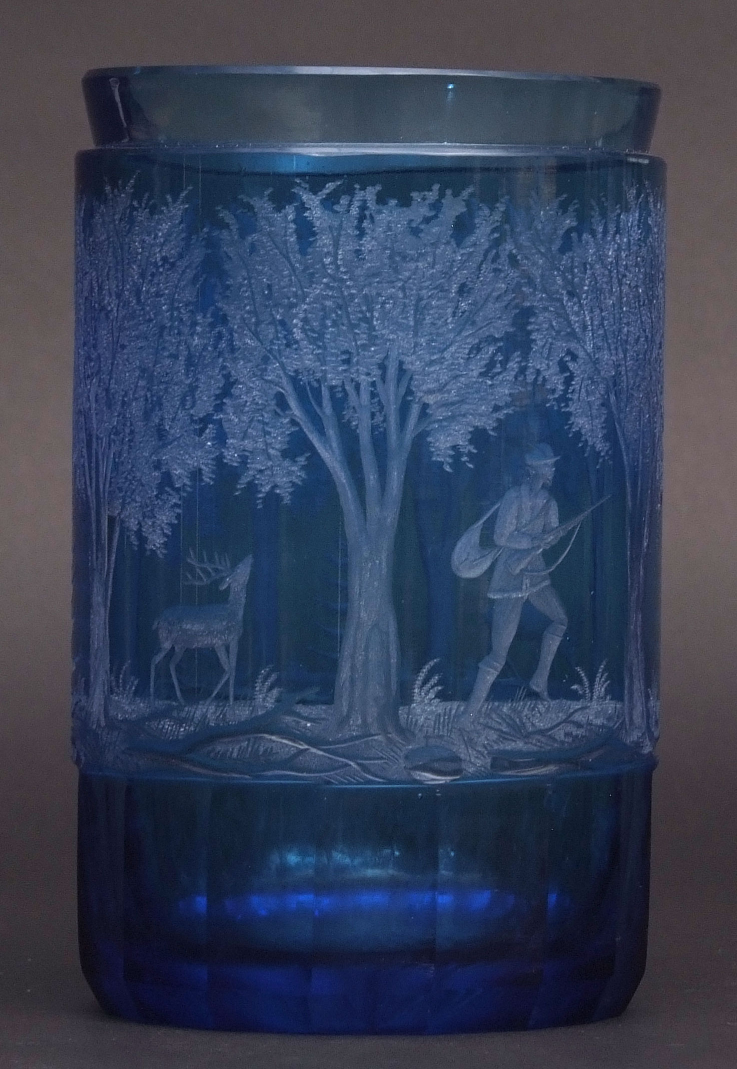 Early 20th century Bohemian blue glass oversized beaker of cylindrical form, etched with an all-over