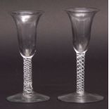 Two 18th century wine glasses, one with air twist stem, the other with opaque twist stem, both