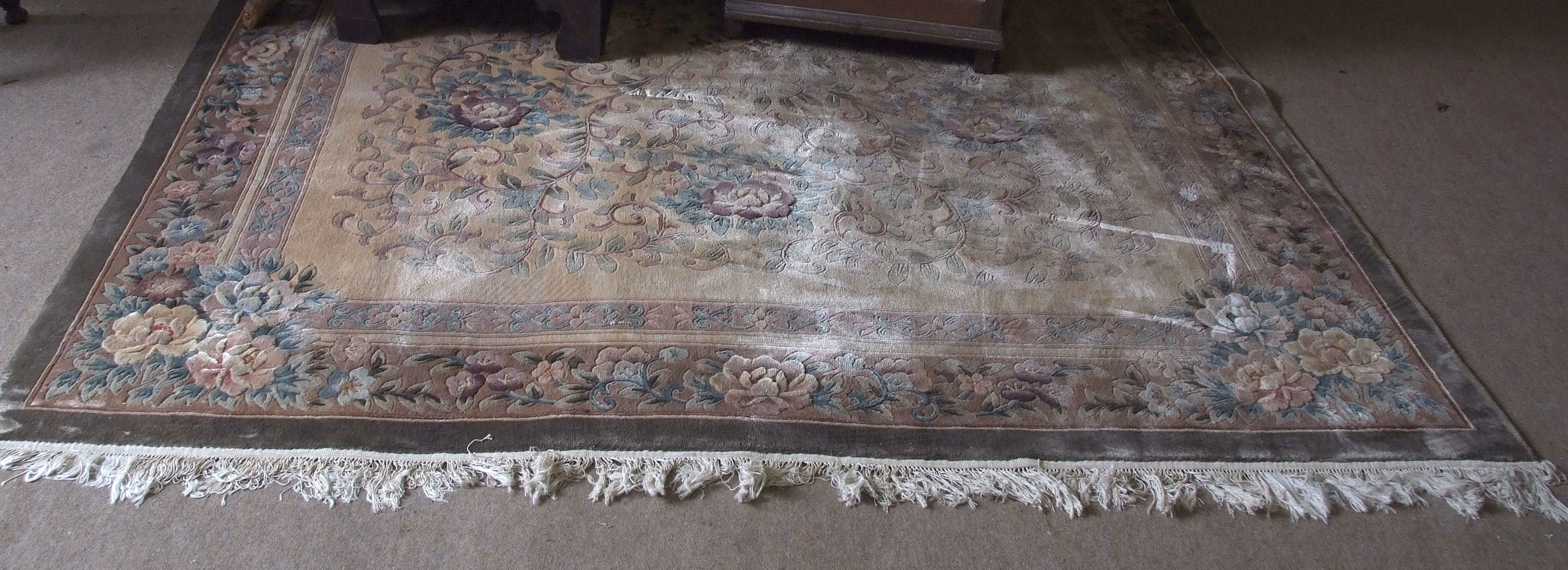 Chinese faded, washed wool carpet, pink and green floral decoration to a beige ground, 118ins x 82