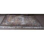 Chinese faded, washed wool carpet, pink and green floral decoration to a beige ground, 118ins x 82