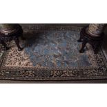 Good quality Iranian silk carpet, decorated throughout with birds and animals amongst trees to a