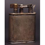 Mid-20th century electro-plated table cigarette lighter, Dunhill, patent no 143752, the oval body