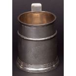 Queen Anne tankard of tapering cylindrical form with reeded rim, girdled body with engraved crest