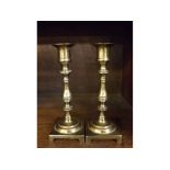 Pair of modern brass candlesticks on square bases with knopped stems, 7 1/2 ins tall