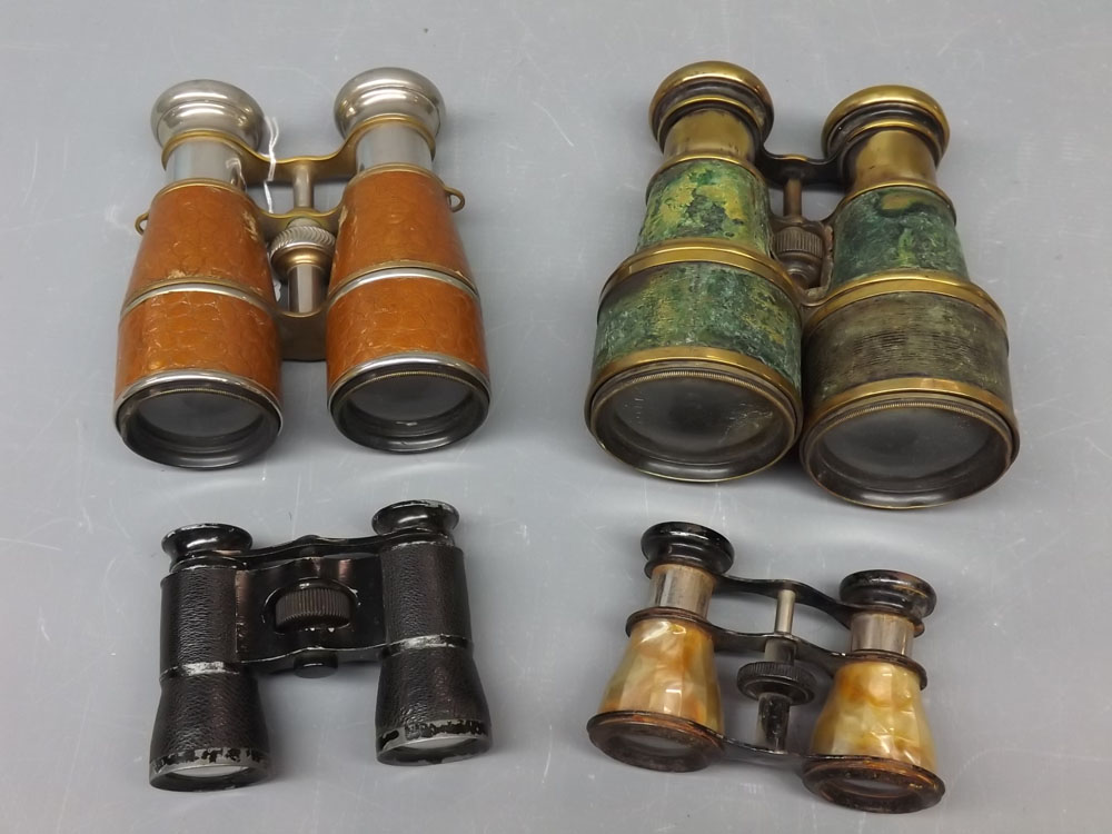 Two pairs of vintage binoculars together with two further pairs of opera glasses (one with mother of