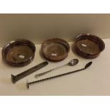 Group comprising pair of antique silver plated (on copper) circular coasters with turned treen