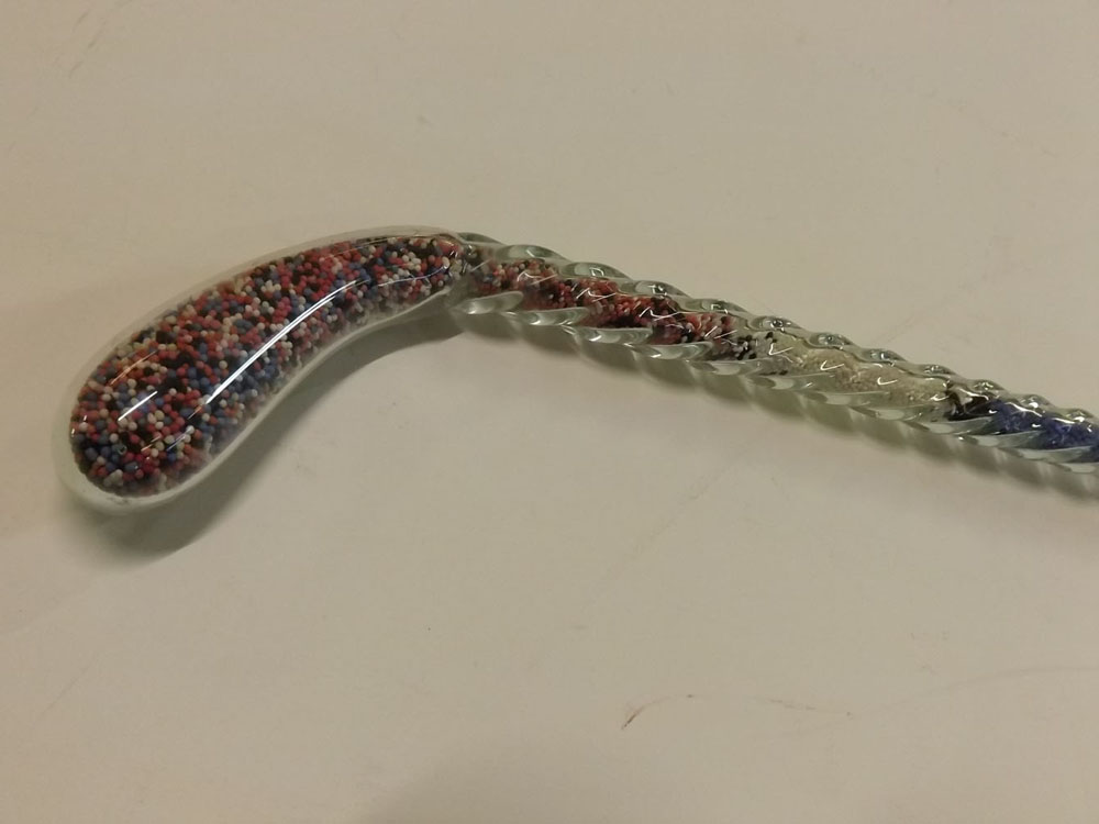 Circa 1910 bead filled walking stick or frigger with multi-coloured bead filled interior, 48ins long