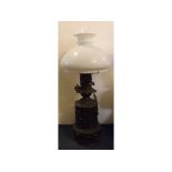 Victorian early embossed metal oil lamp with opaque shade, 21ins tall