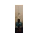 Victorian style cast iron based oil lamp with blue glass font, clear funnel (no shade), 21ins tall