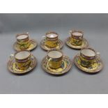 Set of six Chinese coffee cans and saucers with yellow ground and dragon decoration (a/f)