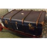 Beechwood and blue rexine covered travelling trunk with lift up tray and brass locks, 36ins wide x