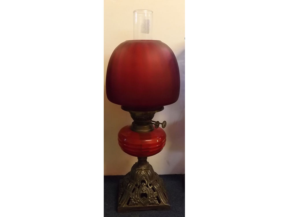 Victorian iron based oil lamp with ruby glass font, ruby shade, 21ins tall