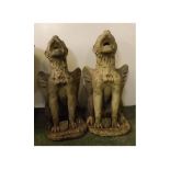 Pair of composition garden gryphons, each with shield at feet, inscribed to banners "S. C C. 1937"