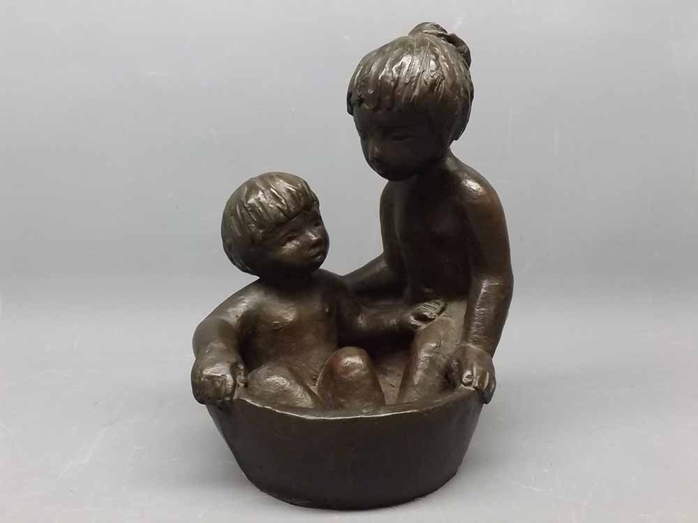 Resin bronzed figure of two children in a bathtub by E J Massingham, 8ins tall