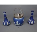 Wedgwood blue and white jasperware biscuit barrel with silver plated lid, labels with inscription "