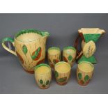 Myott Son & Co lemonade set with painted leaf decorated jug and a set of four matching beakers,