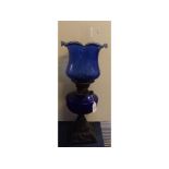 Victorian iron based oil lamp with blue font and matching crimped edge shade, 22ins high