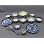 Group of 18th and 19th century blue and white printed wares to include tea bowls, a squat jug, two