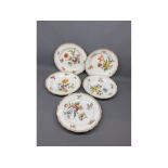 Group of five Meissen shallow bowls, floral painted with gilded rims, blue cross sword mark to