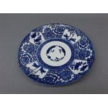 19th century blue and white Oriental decorated plate with floral printed scenes, 9ins diam