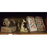 Group comprising pair of cast brass dolphin book rests, a carved pair of wooden elephant book